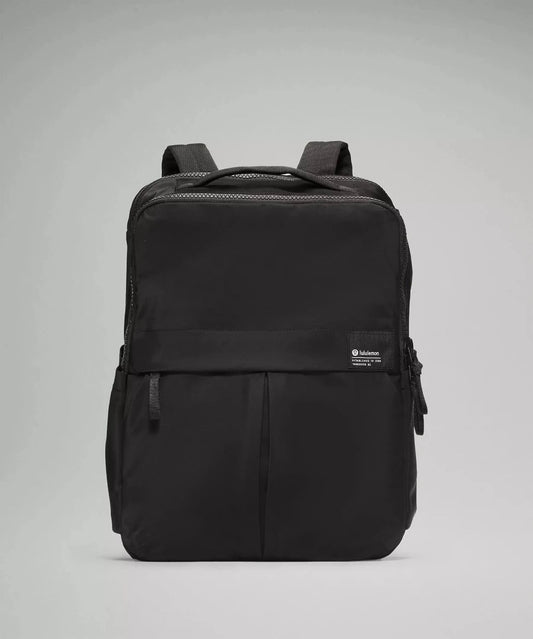 minimalist backpack for work and travel with water bottle holder