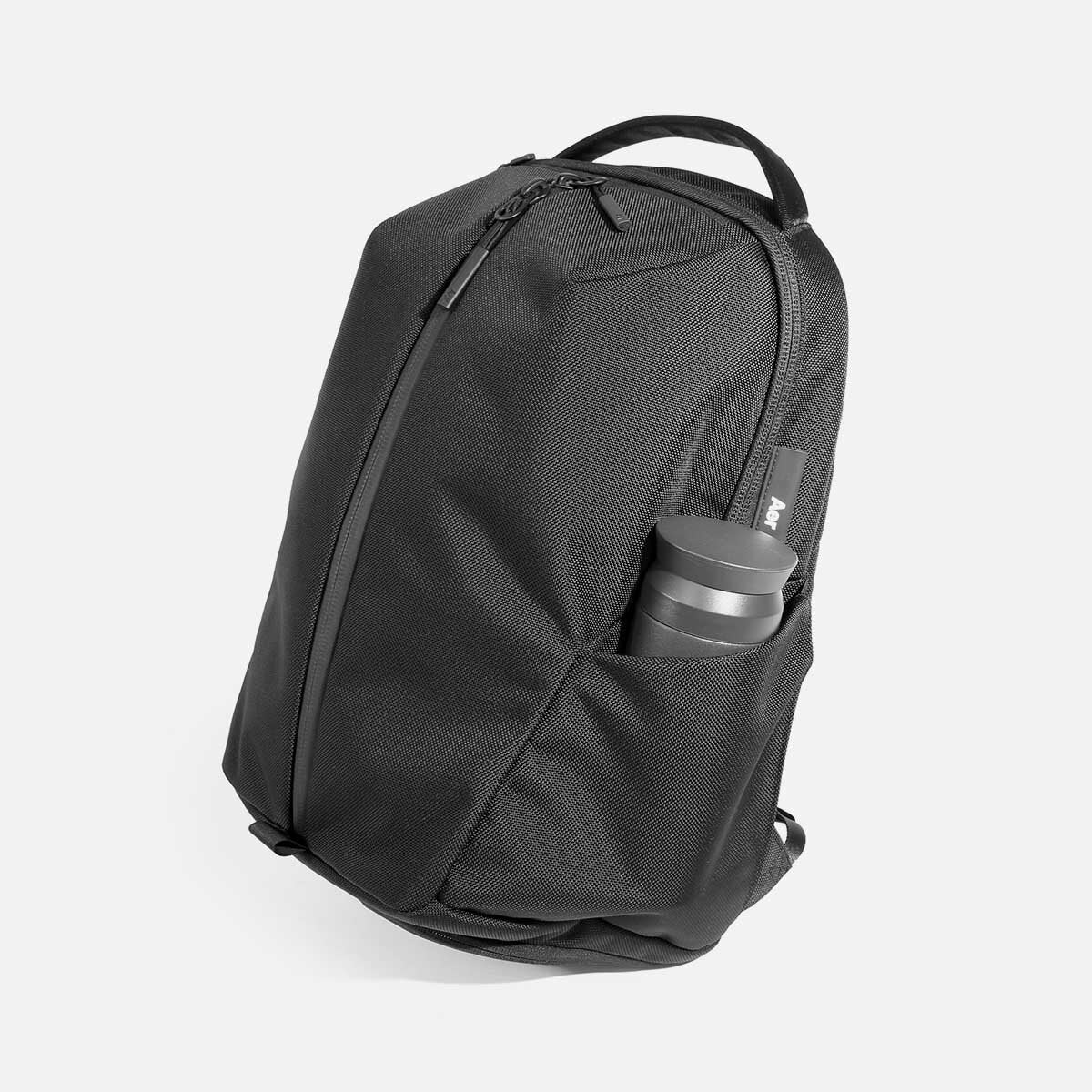 Waterproof backpack with water bottle outlet holder